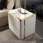 Superior DV Home Collection Elite nightstand with white leather and lightly veined marble top accented by gold-toned stainless steel trim