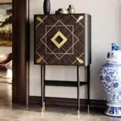 Distinguished Vismara Spirit bar cabinet with Ebony Makassar and maple doors, glossy brass details, plus glass shelving within lacquered fiberboard construction