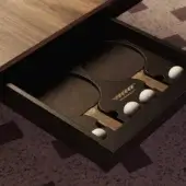 Vismara table tennis table, black matte surface, recessed compartment with paddles and balls, gold Vismara branding, white cylindrical legs.