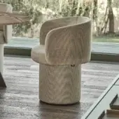 Exclusive Ditre Italia Billie armchair with neutral beige textured textile and sculpted curved silhouette