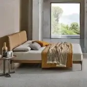 Superior Ditre Italia Ada bed with slimline headboard and light gray upholstered low-profile frame built with dark metal legs