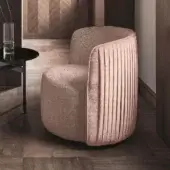 Sophisticated Ditre Italia Chloè lounge chair upholstered in muted mauve textile with vertical pleating on the backrest