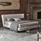 Elegant Ditre Italia Royal bed upholstered in light beige textured textile with a gently sloping headboard