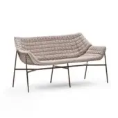 Elegant Varaschin Summer Set sofa with curved steel frame treated with C5M varnishing and light beige quilted textile upholstery