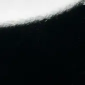 Black and white gradient texture with grainy surface, fine scratches, and diffused sheen, resembling polished lacquer tabletop material.