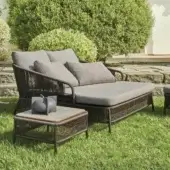 Refined Varaschin Cricket lounger with dark brown hand-woven synthetic fiber and light gray cushions built over powder-coated aluminum