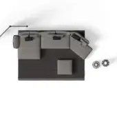 Modular sofa gray fabric, angled chaise configuration, with gray pillows, black metal side table, and woven sphere decor on dark gray rug.
