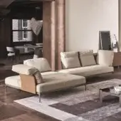 Distinguished Ditre Italia Ada sectional with a low profile and light beige textile upholstery accented with a leather-like panel and satin metal base