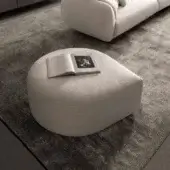 Sophisticated Presotto Drop ottoman with neutral woven fabric upholstery and matte finish presents a contemporary rounded form