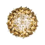 Gold layered ceiling light, metallic finish, radiating crimped elements with white leaf accents, jagged fringe, studio product shot.