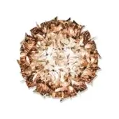 Circular copper light fixture with layered metallic elements, jagged edges, and a bright central core against a white background.