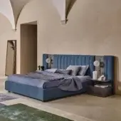Distinguished Ditre Italia Otello bed with textured medium blue fabric and wood accents creating a modern minimalist design