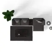 Modular sofa set, dark gray upholstery, textured weave, with green leaf and marble-patterned ottoman, metallic accents, minimalist design.