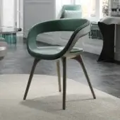Elegant Reflex Nido armchair with smooth green textile upholstery and light-toned wood tapered legs