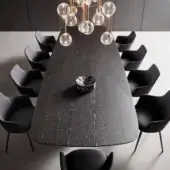Elegant Bonaldo Mellow 400 table with brushed Coal oak and chevron veneered wood top resting on a unique central base