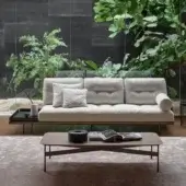 Elegant Bonaldo Maximilian sectional with light beige textured textile and slender dark-toned metal legs