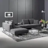 Superior Bonaldo Phil sectional with geometric silhouette upholstered in uniform gray textile and matte varnished metal base