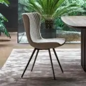 Refined Bonaldo Colibrì chair with light beige textile upholstery and graceful dark brown metal base