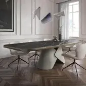 Distinguished Cattelan Italia Scott Keramik table with dark marble-effect ceramic and light brushed edges built upon a cream curved metal pedestal base