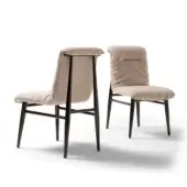 Elegant Costantini Pietro Emily chair with gently arched upholstery and slender dark-toned wooden legs in light beige textile