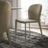 Elegant Cattelan Italia Nancy ML chair with light beige or grey upholstery and curved lines built with slender steel legs