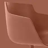 Terracotta chair with smooth, curved form and contoured seat, displayed against a matching terracotta backdrop in a studio setting.
