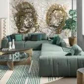 Superior Giorgetti Karphi sectional with muted teal-green textile upholstery and loose cushions in varying shades of green and black