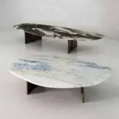 Elegant Rugiano Rock coffee table with organic shape and smooth stone in shades of black, brown, gray with bronzed brass legs