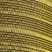 Brass wire mesh texture displaying a repeating grid pattern with warm golden hues and undulating wave formations, brushed metallic sheen.