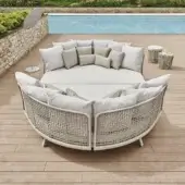 Distinctive Varaschin Emma daybed with woven light beige synthetic material and coordinating checkered cushions