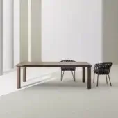 Remarkable Varaschin Customade table with HPL top and cylindrical legs in a light brown finish