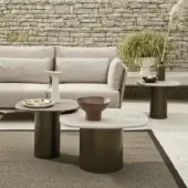 Architectural contemporary coffee table with speckled terrazzo top and dark powder-coated Aisi 304 stainless steel cylindrical base