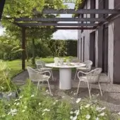 Superior Roberti Rattan armchair with rounded back and woven Round Trendyrope in matte white powder-coated aluminum frame