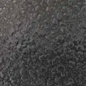 Smoked liquid glass texture, dark gray and black, irregular mirrored surface with glossy sheen and solidified lava-like forms.