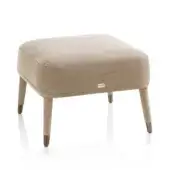 Elegant DV Home Collection Manhattan ottoman with smooth matte beige fabric and cylindrical legs built with stainless steel feet