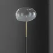 Distinguished Bonaldo Pepita floor lamp with organically shaped clear glass shade and golden metallic accents