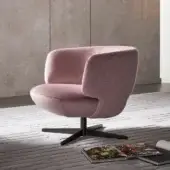 Distinctive Bonaldo Doge lounge chair with curved silhouette and dark metal base, upholstered in light pink matte textile