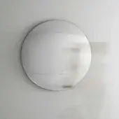 Elegant Tonelli Design Iris mirror crafted in curved clear glass with a reflective silvered surface