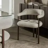Distinguished Cattelan Italia Greta armchair with neutral beige and white textile, button-tufted seat and textured matte bronze metal legs