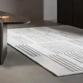 Distinguished Bonaldo Tangeri rug with parallel light and dark gray lines crafted from wool and Tencel with a matte finish
