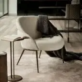Elegant Cattelan Italia Camilla lounge chair in textured light beige fabric with dark bronze metal legs