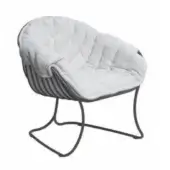 Lounge chair, quilted gray and white striped fabric, rounded form with dark gray metal tubing frame and draped white blanket.