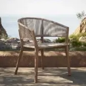 Distinguished Royal Botania Carés armchair with teak frame and light beige rope woven seat offering a matte finish