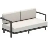Distinguished Royal Botania Alura lounge sofa with geometric form and off-white cushions in a matte dark gray finish