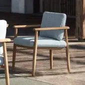 Distinguished Royal Botania Mambo armchair crafted with wood and light blue textile cushions in a smooth natural finish