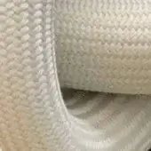 Beige rope coil with interlaced braid texture, cylindrical form, and subtle sheen, likely synthetic fiber with warm, heathered tones.