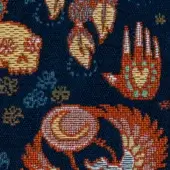 Navy textile with scattered floral and abstract motifs in orange, yellow, teal, and white, featuring a pixelated woven texture.