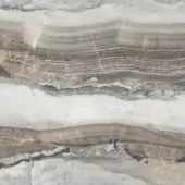 Onice grigio stone slab displays layered bands of white, brown, gray, and black with a smooth, reflective surface and neutral earth tone palette.