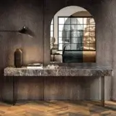 Distinguished Lago Materia console with marble-patterned XGlass top and sleek dark metal legs creating a floating effect