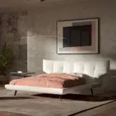 Distinguished Cattelan Italia Thomas bed with soft white upholstery and a quilted headboard supported by slender dark metal feet